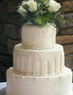Stacked rolled fondant wedding cake with fondant detailing