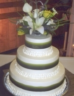 Green ribbon wedding cake
