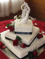 Roses, baby's breath and hearts on stacked askew squares. This design is just as dramtic with single layer cakes