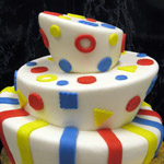 A whimical cake in primary colors.